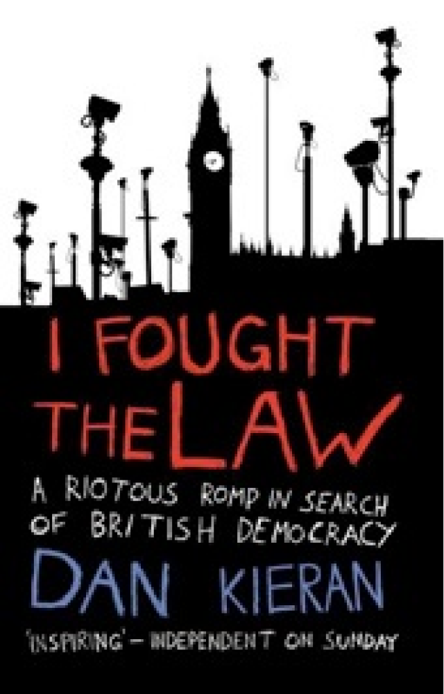 I Fought the Law: A Riotous Romp in Search of British Democracy by Dan Kieran — book cover featuring a stark black silhouette of Big Ben surrounded by CCTV cameras